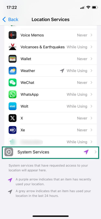 The Location Services settings page of an iPhone, with the System Services button highlighted.